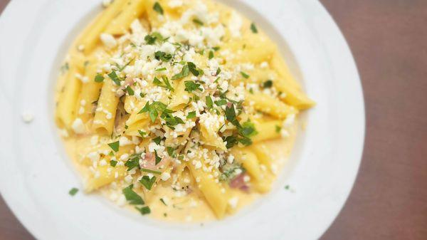 Pennine pasta in a creamy, smoked mozzarella and Grana Padano Cheese sauce, drizzled with truffle oil and topped with crumbled goat cheese