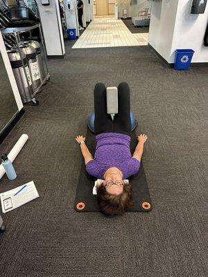 Client strengthens lower body and core .