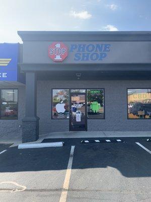 Store front in front of Walmart between shoe inn and subway