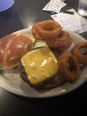 Cheeseburger deluxe with onion rings. Very juicy and tasty.