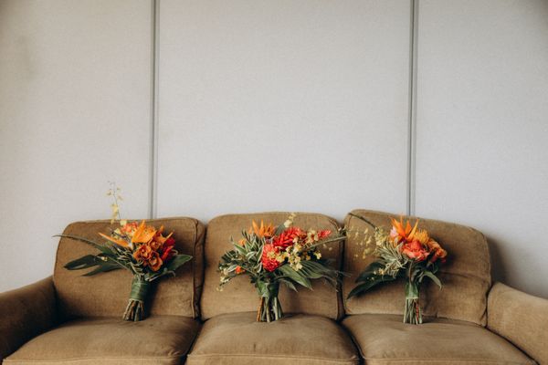 One bride bouquet and two bridesmaids bouquets.