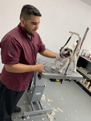 Johnathon in his new shop with Gizmo.