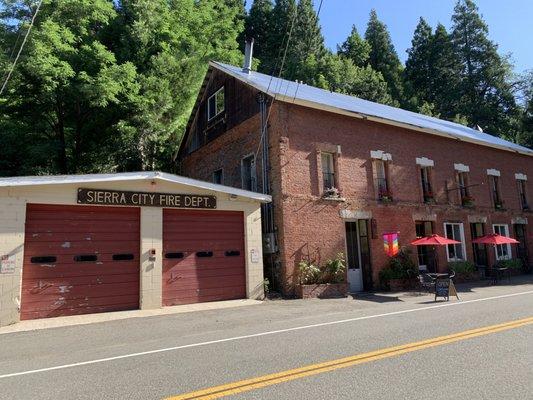 The coffee house is in a building next to the local fire department.