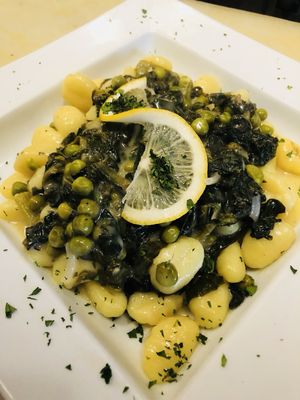 Potato gnocchi in a lemony cream sauce, spinach, and peas.