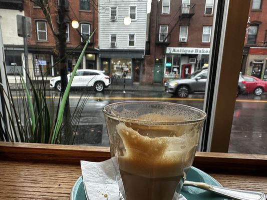 Rainy outside and enjoying a cappuccino.