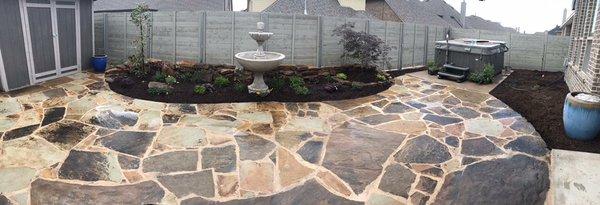 Flagstone patio and flower bed