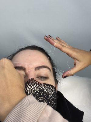 Eyebrows threading