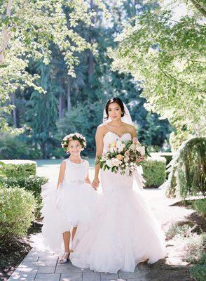 The bride and her flower girl.  Design & Coordination by New Creations Weddings.  Photo by O'Malley Photography.  Floral by Floressence.