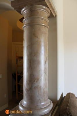 This column has a natural travertine look to it now. The neutral colors in the paint go with the flooring and the plaster I d...