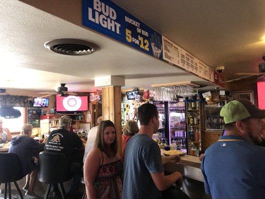 Busy bar area complete with hardworking and kind bartenders!