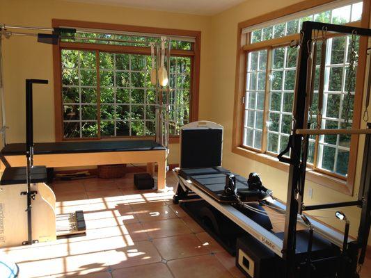 Inside the studio, view of the Reformer and Cadillac.