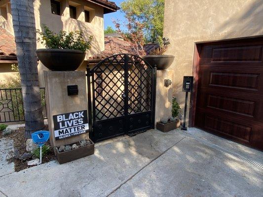 Smart video doorbell mounted beside gate with access control system.  See who is at the door before you allow access from the iPhone app