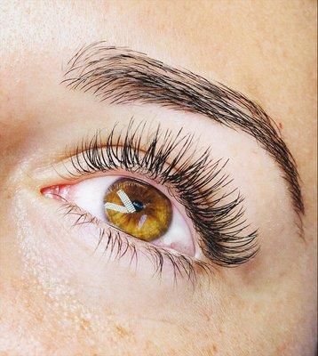 Natural set of eyelash extensions and eyebrow wax.