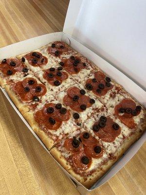 Pepperoni and black olive pizza