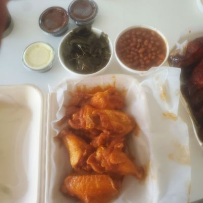 Buffalo sauce chicken wings. Also baked beans and collard greens which were sides with our ribs