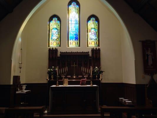 Alter and stained glass window.