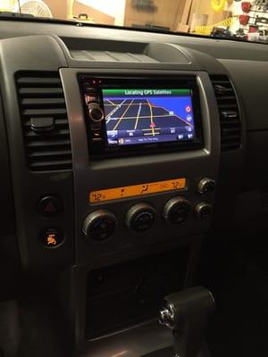 A Kenwood Garman navigation multi media radio installed in a Nissan Xterra