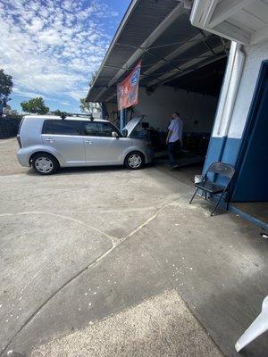 Sam doing a "full" smog check. I haven't ever seen them look under the car. Well done