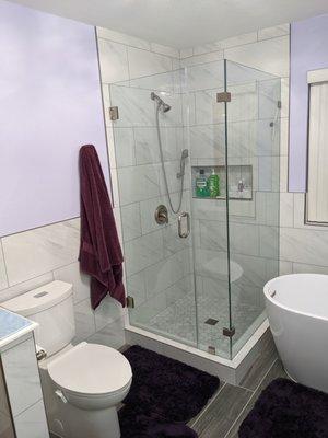 Moved shower to opposite wall and made all glass shower.