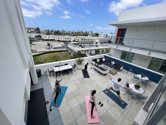 This sunset deck is the perfect spot for a group yoga session, provided free for residents!