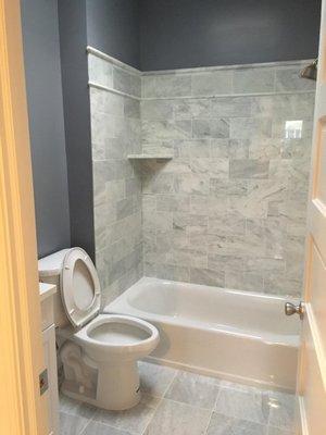 Fully renovated Bathroom, tiles, paint, toilet, sink mirrors