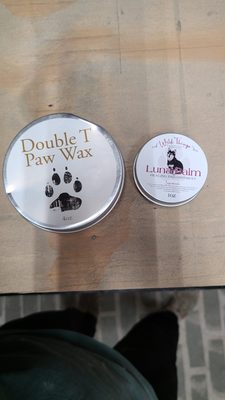 We sell and use locally made paw conditioning wax. Call us to learn more!