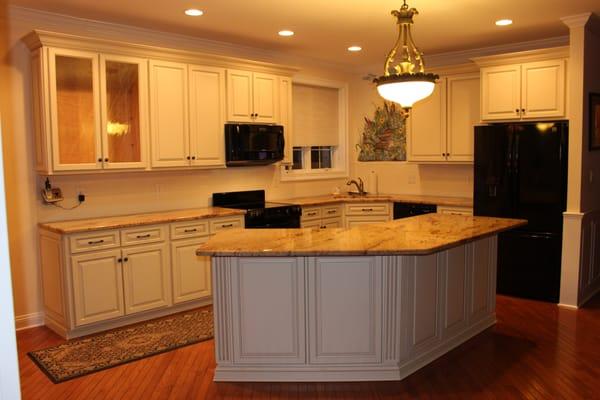 Cabinet Refacing - Transforming dark cabinets to a bright vibrant look.