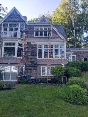 replaced all the rotten wood trim amd replaced it with PVC board, painted ALL of the trim and replaced sections of cedar shake siding.