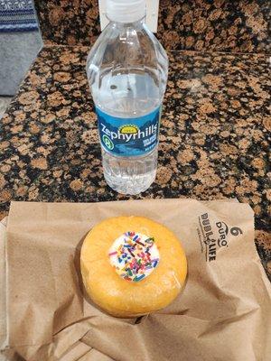 Holland Cream Filled donut and a bottle of Zephyrhills water