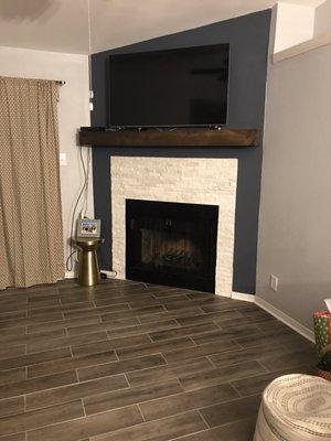 Remodeled fireplace and installation of wooden beam