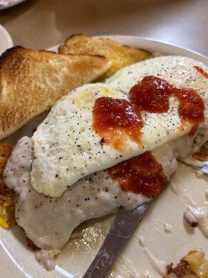 Smothered hash browns, eggs and toast 10$