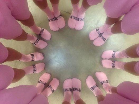 The players all loved their breast cancer awareness socks to play basketball in!