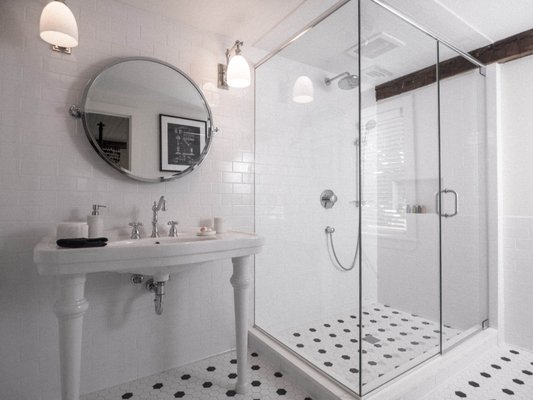 Sparkling tile and an oversized steam shower. This is in the Katharine Hepburn room. See more at jamespharmacybnb.com