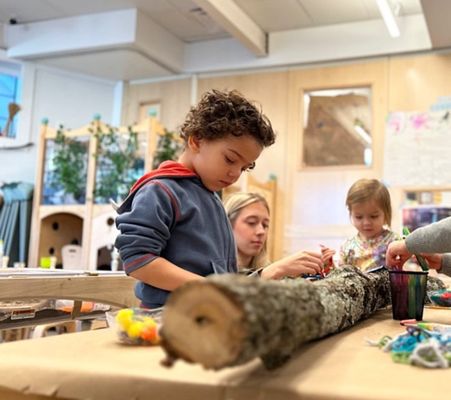 Preschoolers exploring nature inside the classroom