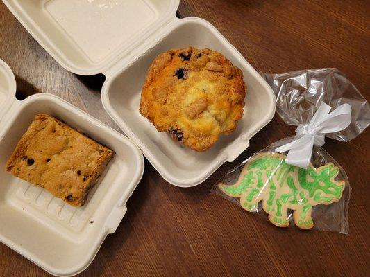 Brownie with nuts, blueberry muffin, and dinosaur cookie