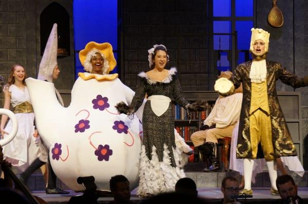 Megan Cheng, as Babbette, with Mrs. Potts and Lumiere singing Be Our Guest, Beauty and the Beast.