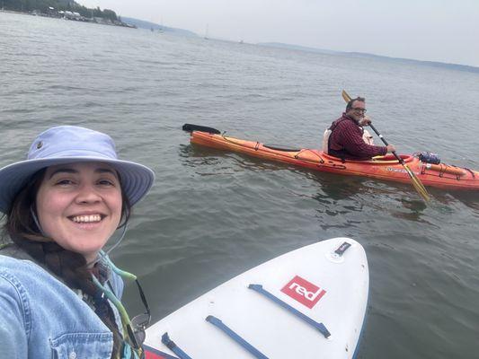 Paddleboarding and my dad kayaking.