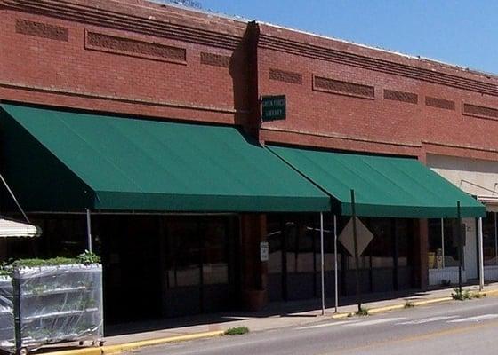 The Green Forest Public Library is located on the east side of the Green Forest Square.