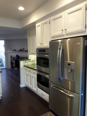 Painting Kitchen Cabinets in Danville as part of Water Damage Restoration Project