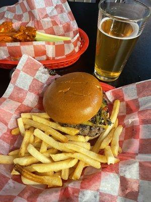 Green chile cheeseburger, delicious hot wings, and a cider beer