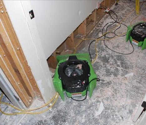 The water cascaded into this lower level area causing water damage in Agoura Hills. The flooring was removed and the drywall ...