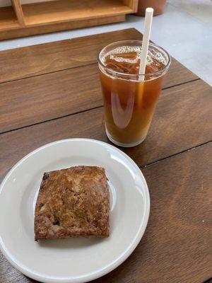 Mushroom Gruyère scone and iced coffee with a splash of oat milk