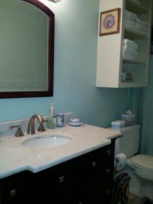 Marble vanity in full bath.  Home also features a half bath between the two bedrooms.