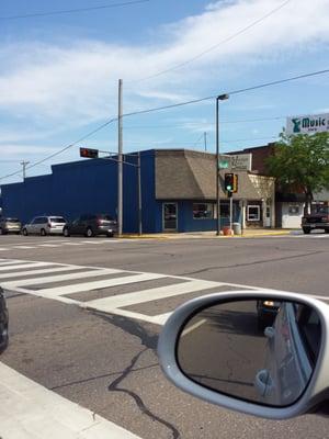 Blue building at stoplight downtown.