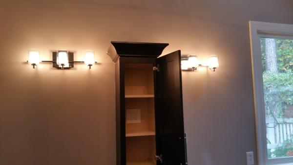 vanity lighting including in cabinet outlets