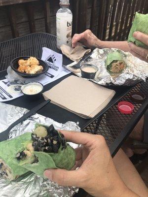 Two wraps, buffalo cauliflower side, and drinks.