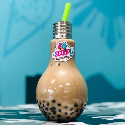 Milk tea with boba in a bulb bottle