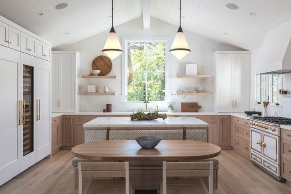 Kitchen with hardwood flooring by Samaya's Flooring & Design.