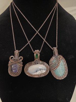 Copper wire-wrapped pendants in a variety of stones.