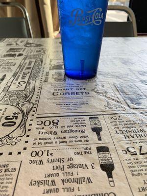 old time newspaper table cloth.... i like it